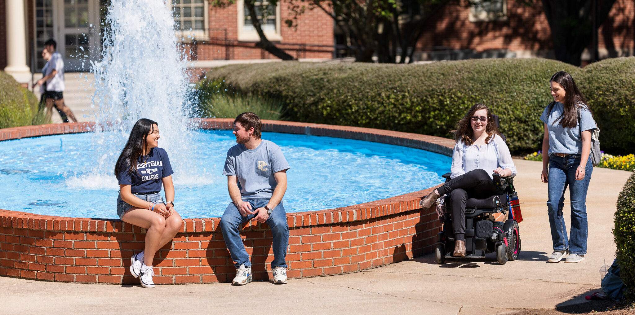 Presbyterian College students sitting by the fountain, for accessibility and accomodations