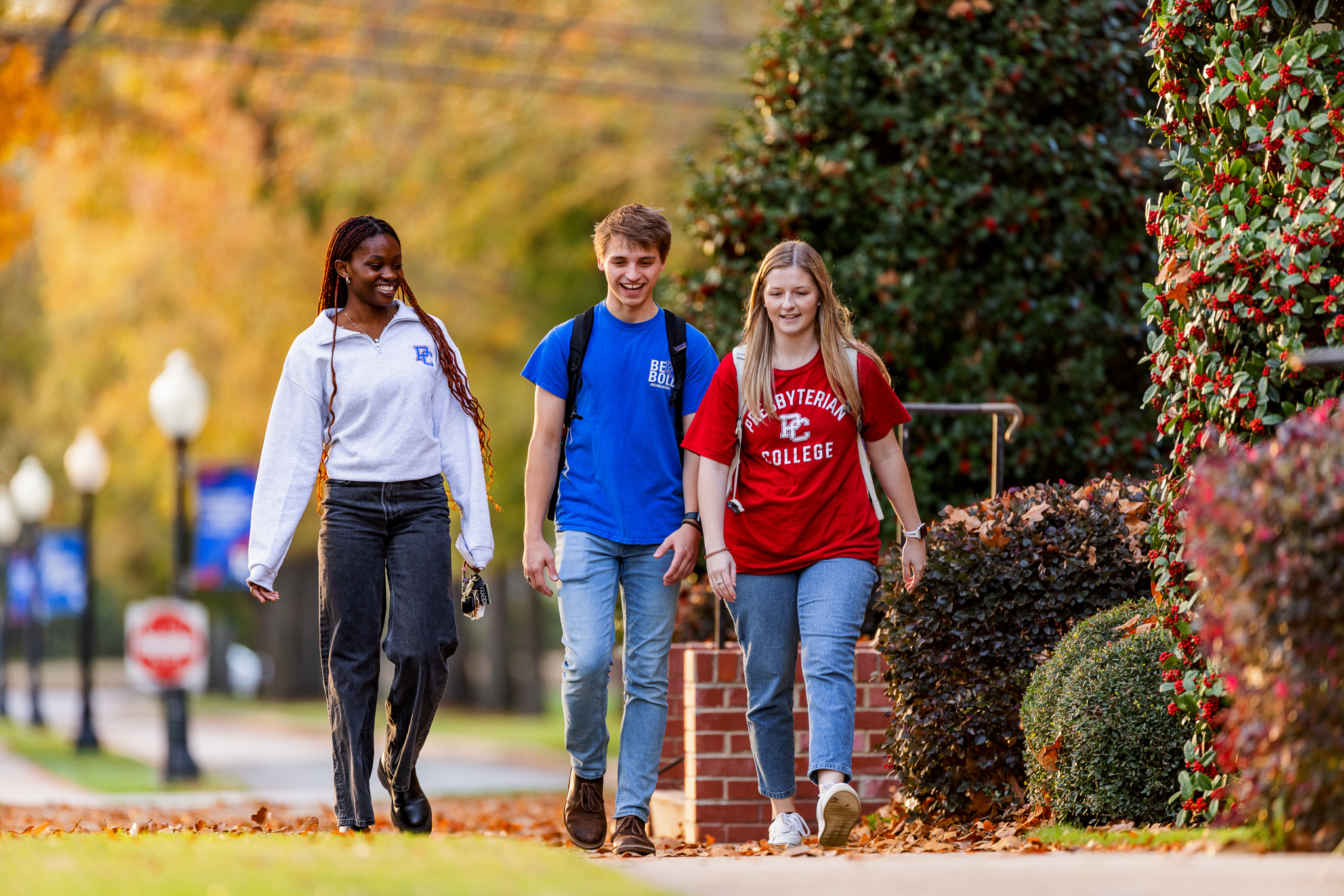 Presbyterian College students walking through campus in the fall.