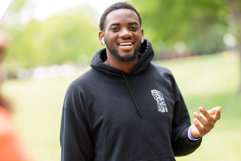 A Presbyterian College student smiling on campus. 