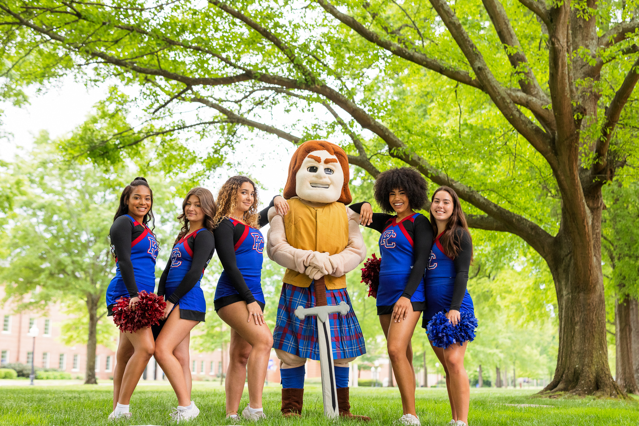 PC cheerleaders posing with Scotty the Scotsman. 