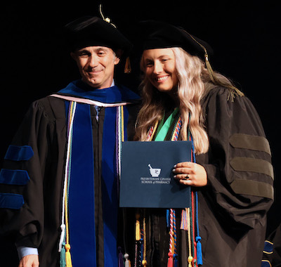 Dr. Audra Butler, a 2025 graduate of the Presbyterian College School of Pharmacy, with dean Dr. Giuseppe Gumina.