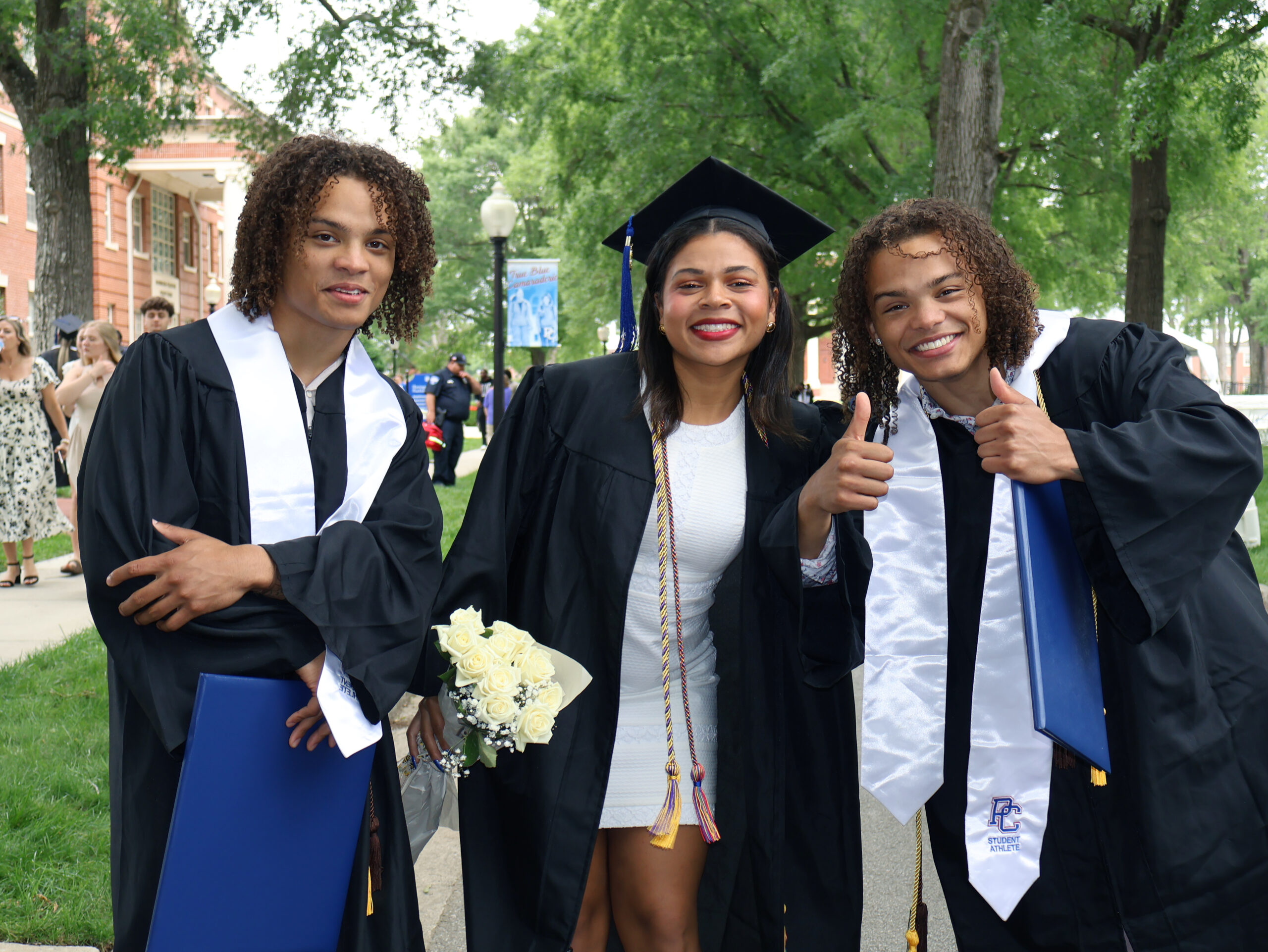 Students smiling after graduation.