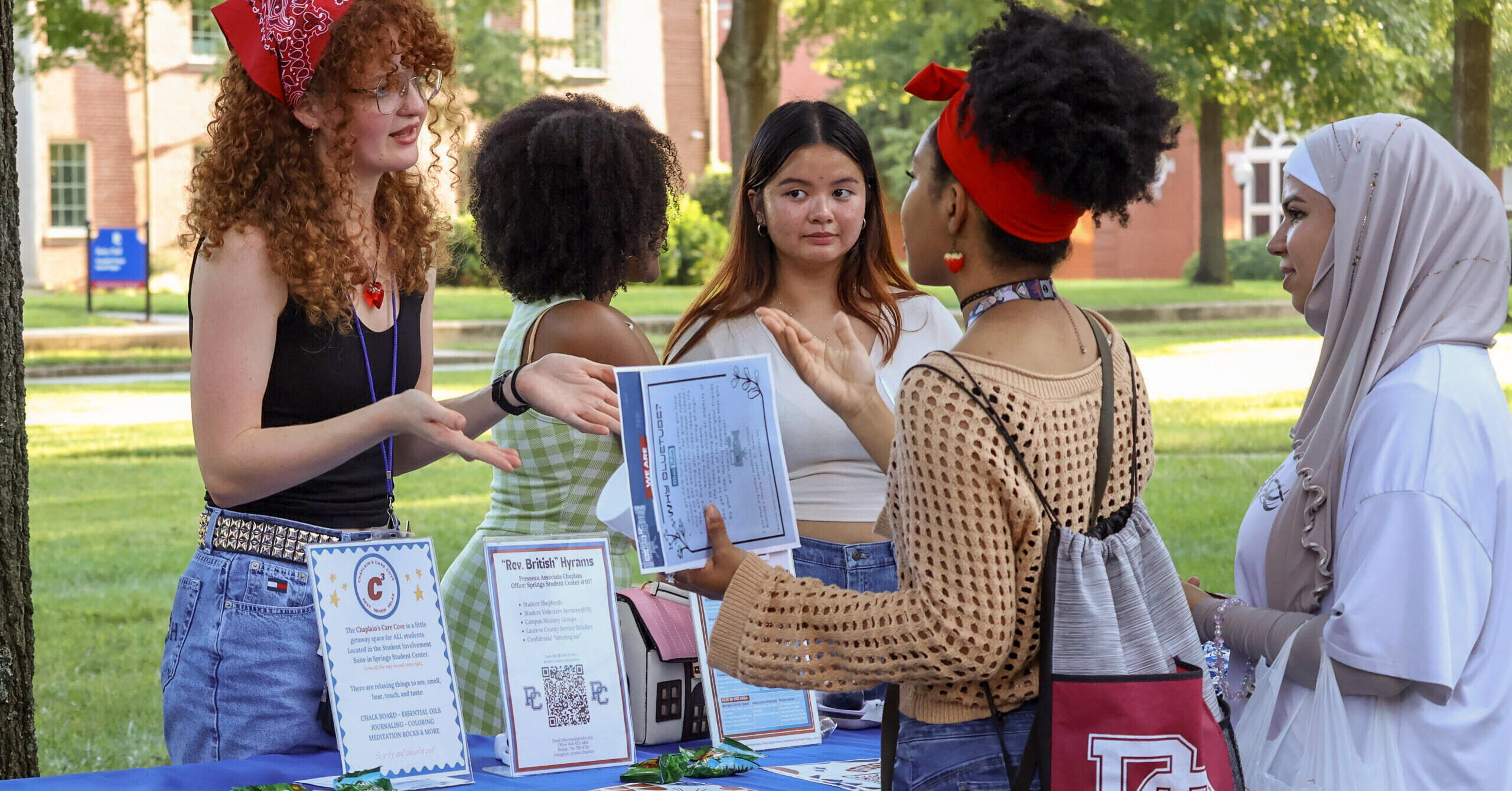 Presbyterian College students talking at a Registered Student Organization (RSO) fair.