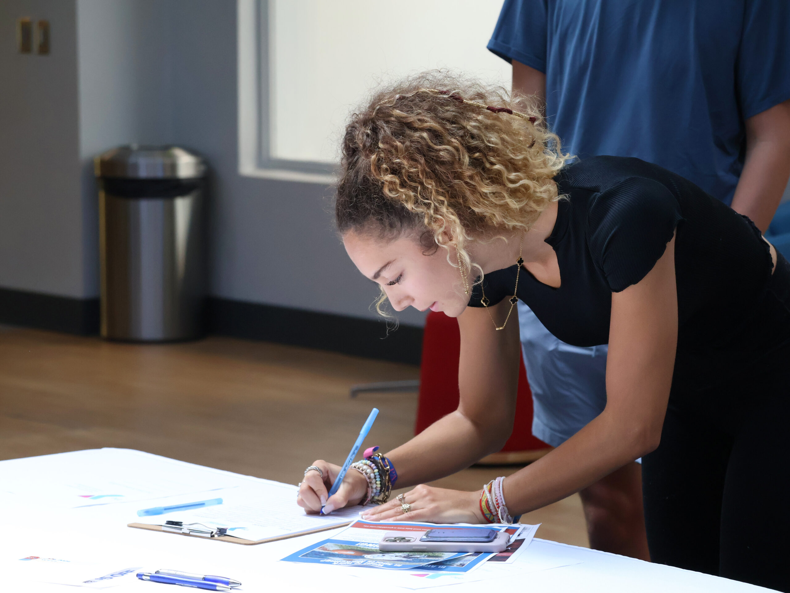 Presbyterian College student signing up for a part-time job at a job fair.