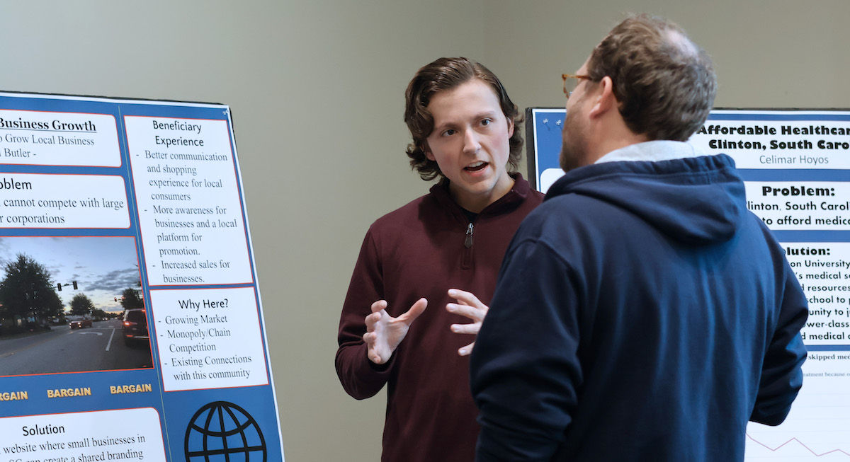 Presbyterian College student Nigel Butler discussing his service entrepreneurship project with PC professor Dr. Ben Bailey.