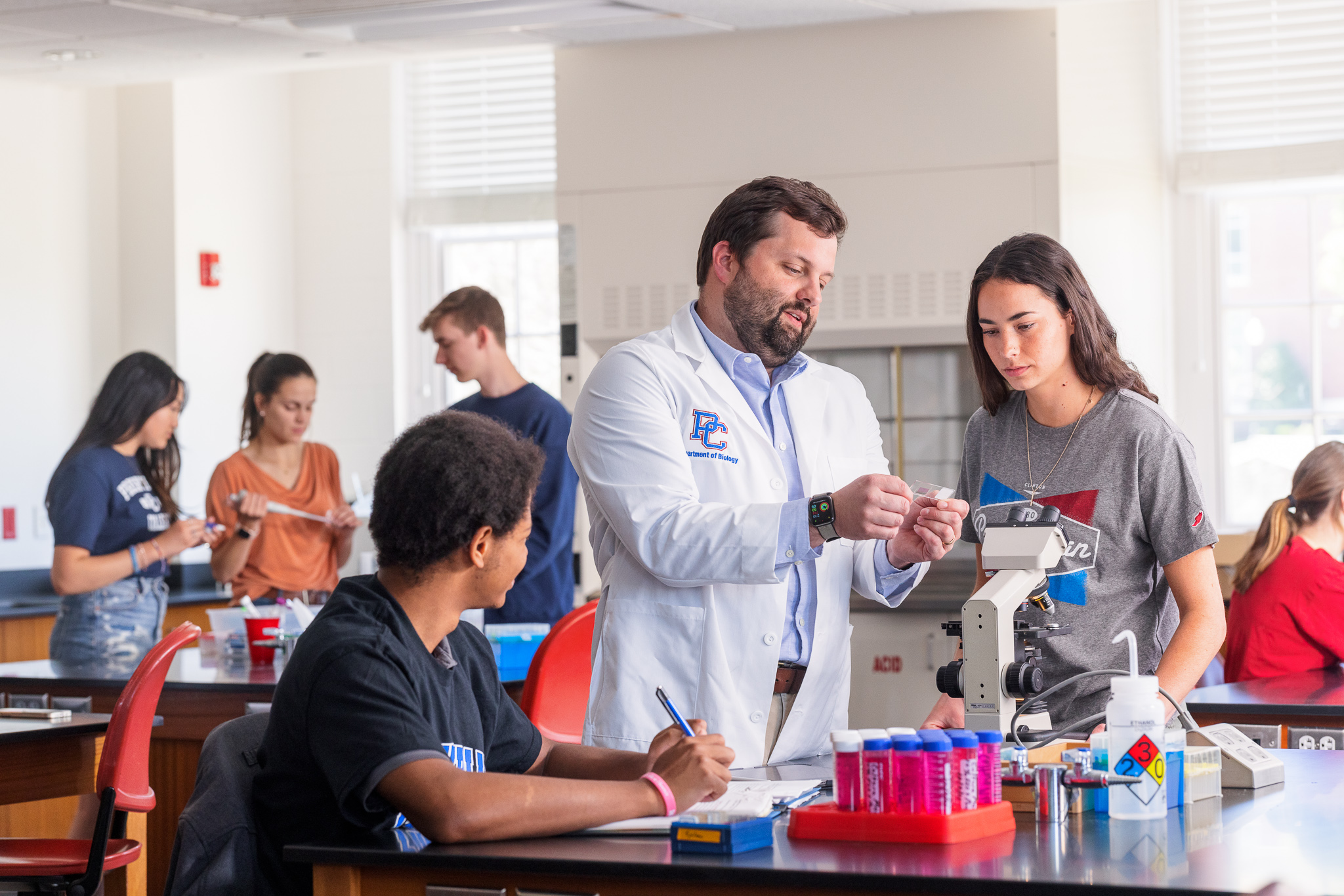 Dr. Austin Shull teaching a biology lab. 