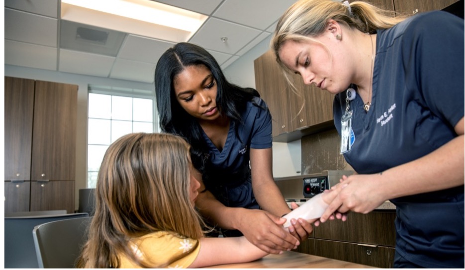 Occupational Therapy Doctoral students working with a patient.