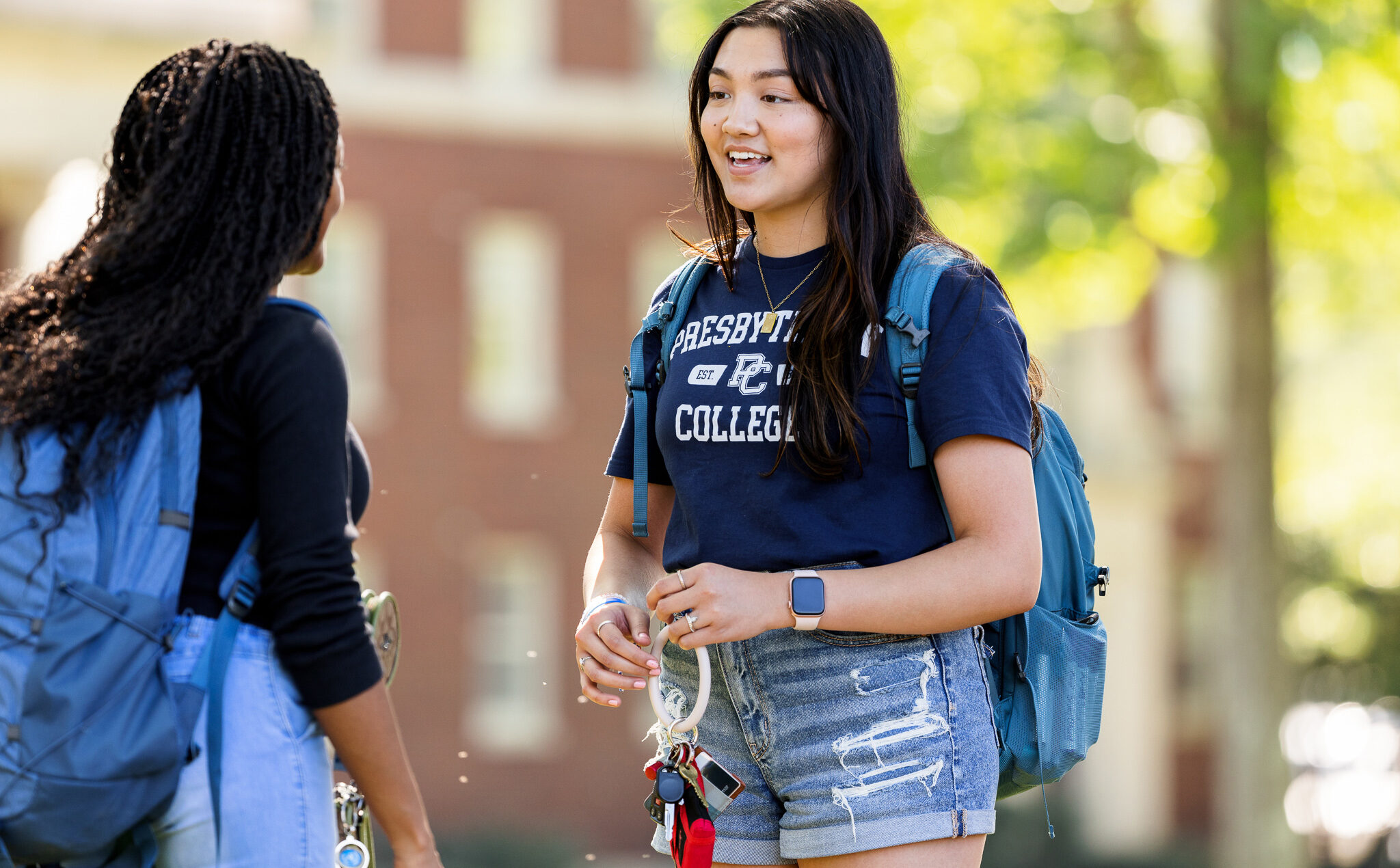 Two Presbyterian College students talking on campus.